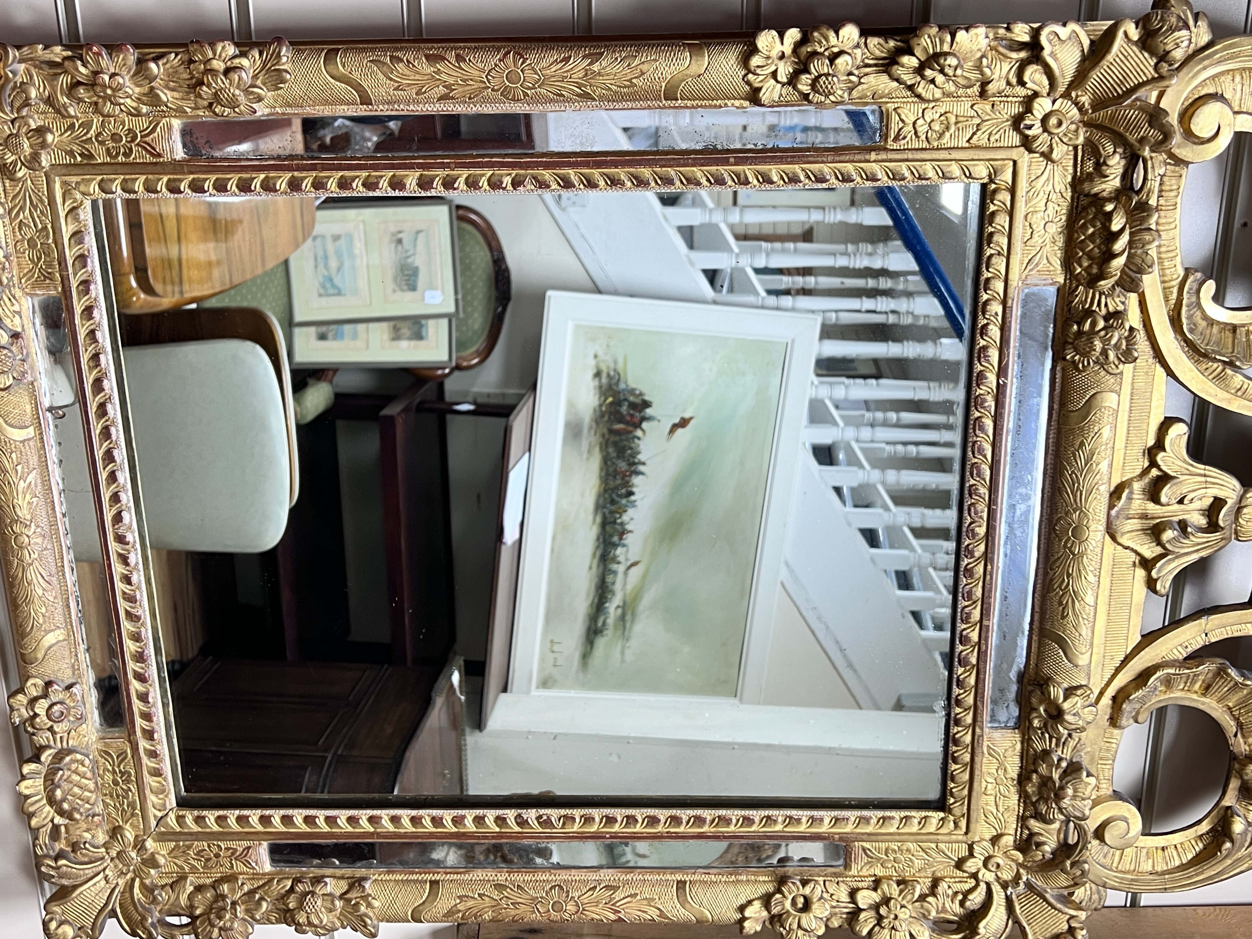 An early 19th century French carved giltwood and gesso wall mirror, W.60cm H.120cm